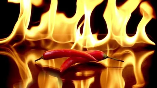Hot Red Chili Peppers in Flames Burn