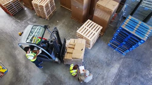 Warehouse worker working and interacting with each other