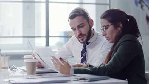 Office Workers Discussing Documents