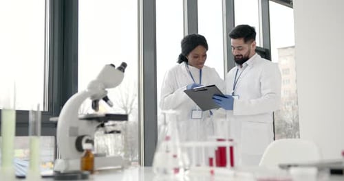 Scientists Reviewing Data in a Bright Lab