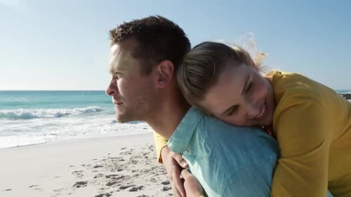 Couple in love enjoying free time on the beach together