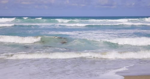 Super slow motion waves and beach at seaside in Cornwall