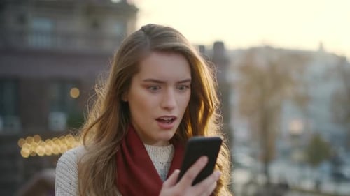 Woman Receives Exciting News on Mobile Phone