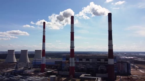 Slow flight to a floating thermal power plant in an industrial area.