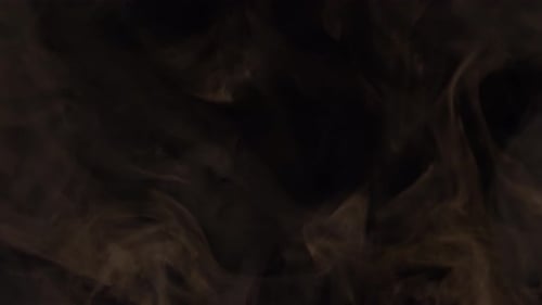 Swirling Brown Smoke on Black Background