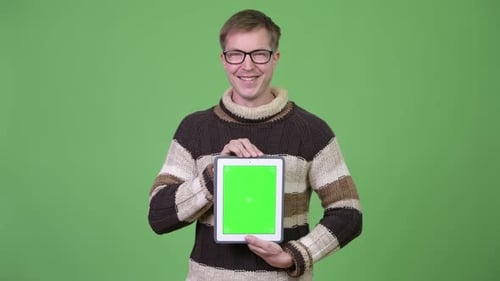 Man Holds Tablet with Chroma Key on Green