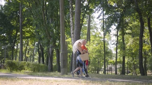 Happy Mature Couple Walking in the Park Together