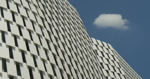 Building Facade with Geometric Pattern Against Blue Sky