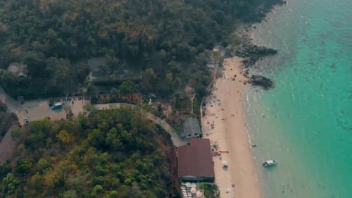 Azure Ocean Waves Roll on Sand Beach with People Aerial View