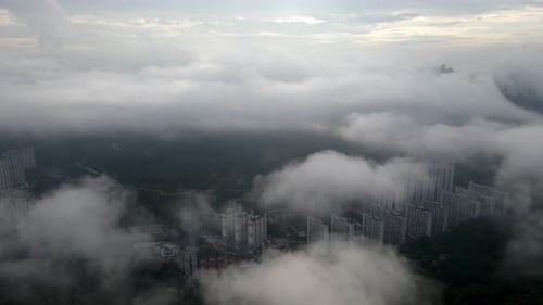 Aerial view fly over the low cloud at Paya Terubong residential area