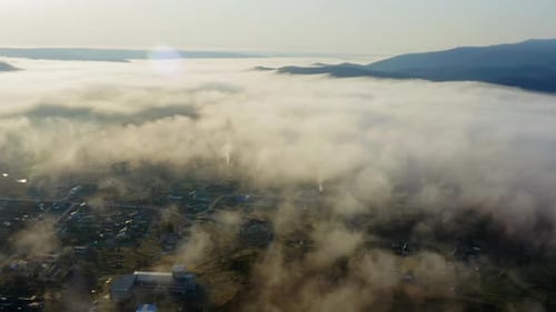 Flight Over the Valley Covered with Morning Mist in the Countryside