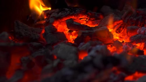 Close Up View of Burning Coals with Fire, Glowing Charcoal Background