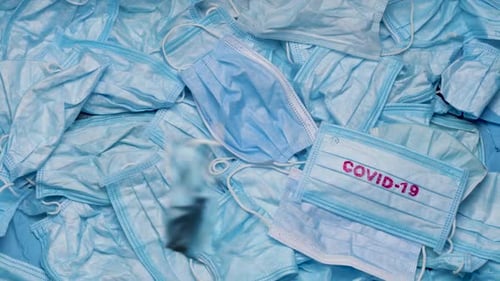 Close Up of Pile of Blue Medical Masks