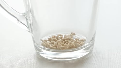 Light Tan Granules in a Glass Mug