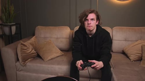 Young Adult throws Controller after Gaming