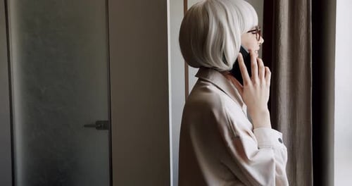 Woman Talking on Phone in Modern Home