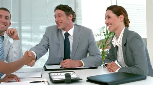 Business People Shaking Hands at Office Meeting