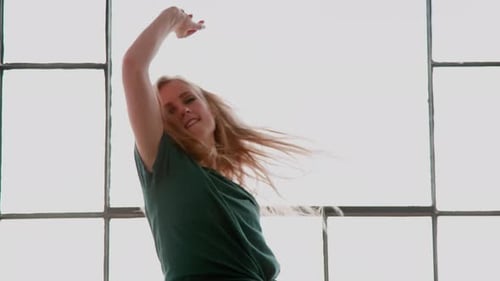Blonde Woman Dancing in Studio