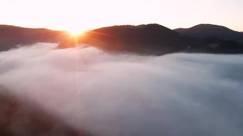 Aerial View of Foggy Sunrise in the Mountains