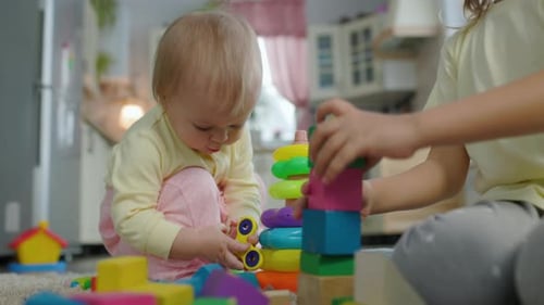 Children Playing with Toys Together Indoors