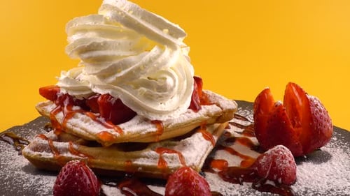 Waffles Piled High with Strawberries and Cream