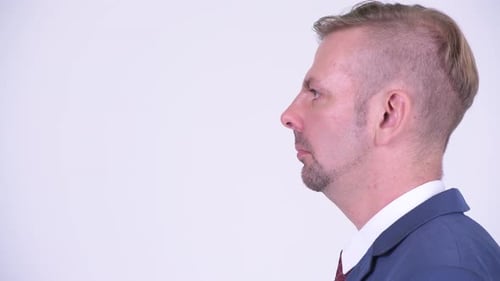 Head Shot Profile View of Happy Blonde Businessman Smiling