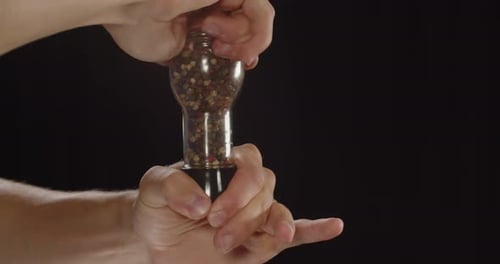 Grinding Colorful Peppercorns in Pepper Grinder