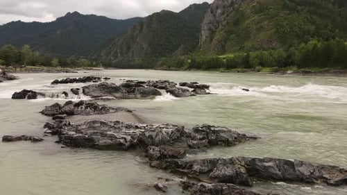 River Stones in a Turbulent River