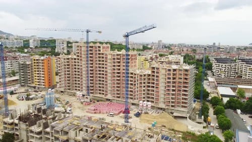 Busy Construction Site and Construction Equipment Aerial View