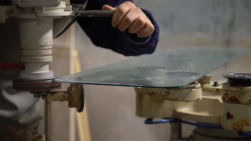 Glass Edge Being Smoothed by Machine