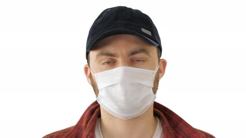 Man Wearing Mask Gives Thumbs Up on White