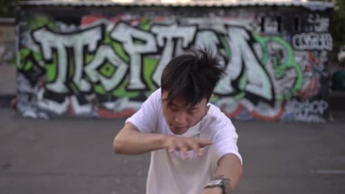 Asian Teenager Dancing Hip Hop in the Street