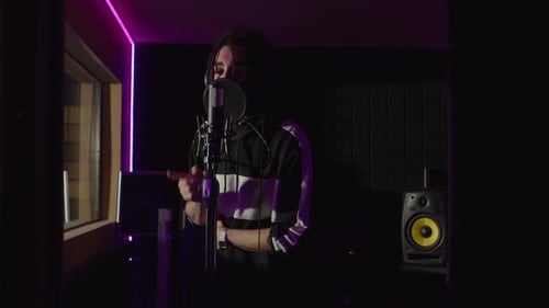 Performer Singing in Recording Studio at Night