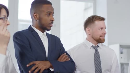 Diverse Business Team Listening in Modern Office