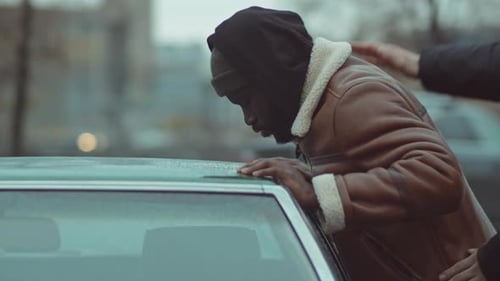 Black Man Being Searched by Police