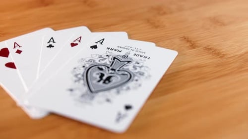 Close Interior Static Shot of Four of a Kind Card on a Spinner