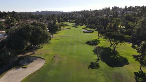 Aerial View of Golf in Upscale Residential Neighborhood During Autumn Season