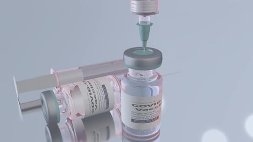 Syringe Draws Liquid from COVID-19 Vaccine Vial