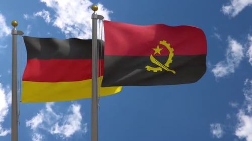 Flags of Germany and Angola Waving in Blue Sky
