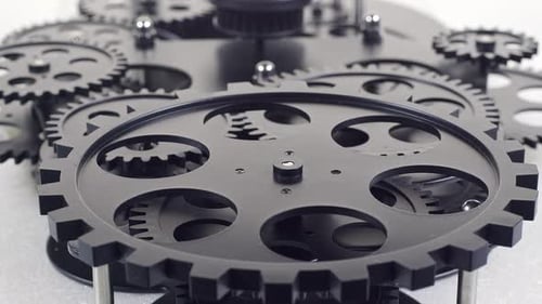 Rotating Gears Meshing in Intricate Machine Assembly