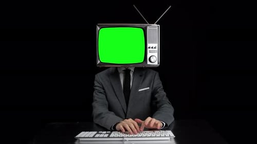 Man Typing TV Head Showing Green Screen Screen