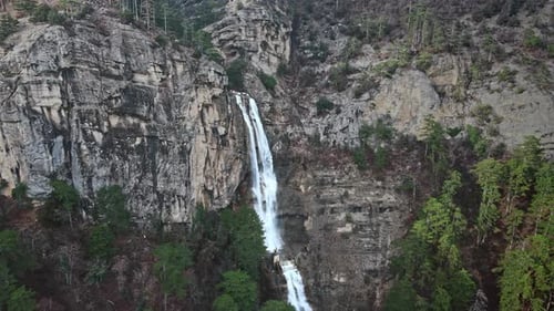 Aerial View of the Powerful Mountain Waterfall in Cloudy Weather