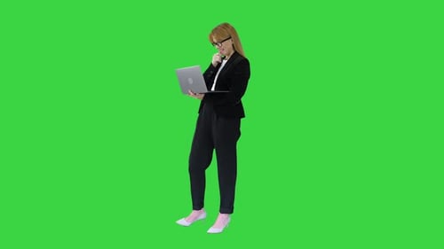 Business Woman Working on Laptop Smiling on a Green Screen Chroma Key