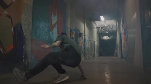 Young Adult Male Breakdancing in an Urban Location