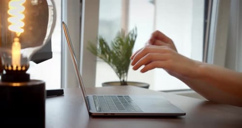 Female Hands Using Typing on Laptop Notebook Keyboard Sit at Home Office Desk Working Online Close