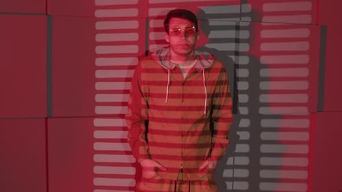 Man Near Wall with Shadows of Jalousie