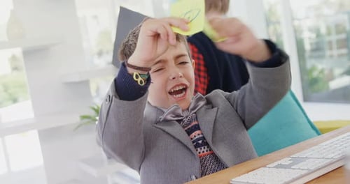 Excited boy playing with sticky notes 4k