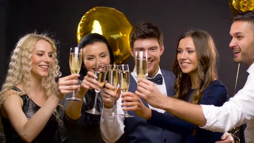 Smiling Friends Toasting Champagne at Party