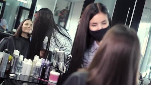 Stylist Applying Makeup in a Modern Salon