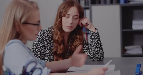 Two Women Collaborating in a Modern Office